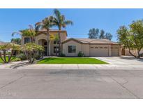 Two-story house with palm trees, a three-car garage, and a well-manicured lawn at 3503 E Princeton Ct, Gilbert, AZ 85234