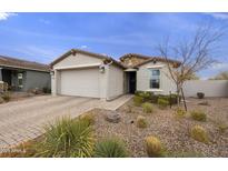 Single-story home with a two-car garage and landscaped front yard at 5929 S Del Rancho --, Mesa, AZ 85212