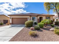 Charming single-story home featuring a well-manicured desert landscape and a brown tiled roof at 1081 W Brangus Way, San Tan Valley, AZ 85143