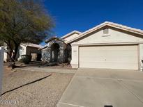 Single-story house with a two-car garage and desert landscaping at 1324 W Michigan Ave, Phoenix, AZ 85023