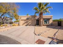 Attractive single-story home with desert landscaping and a two-car garage at 14667 N Love Ct, Fountain Hills, AZ 85268