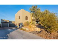 Two-story home with attached garage and desert landscaping at 15302 E Lotus Ln, Fountain Hills, AZ 85268