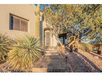 Ornate front entry with stone steps and mature trees at 15302 E Lotus Ln, Fountain Hills, AZ 85268