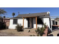 White house with gray accents, wood pergola, and landscaped yard at 2118 E Oak St, Phoenix, AZ 85006