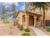 Charming single Gathering home with a cozy porch and desert landscaping at 3883 E Santa Fe Ln, Gilbert, AZ 85297