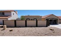 House exterior with a wall and desert landscaping at 5421 W Brown St, Glendale, AZ 85302