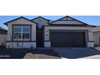 One-story home with a two-car garage and neutral color scheme at 5469 E Rock Bush Ln, San Tan Valley, AZ 85140