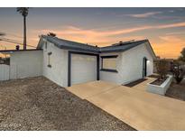 Charming single-story home with a well-maintained garage, driveway, and stylish exterior paint at 6201 W Maryland Ave, Glendale, AZ 85301