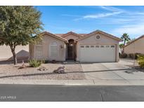 Single-story home with a two-car garage and desert landscaping at 6871 S Coral Gable Dr, Chandler, AZ 85249