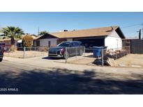 Ranch style home with carport and fenced yard at 921 S Pioneer --, Mesa, AZ 85204