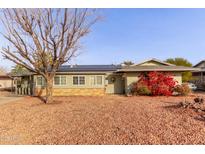 Ranch style home with solar panels and landscaping at 10126 W Sun City Blvd, Sun City, AZ 85351