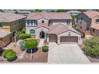 Two-story house with landscaped yard and two-car garage at 11050 E Ravenna Ave, Mesa, AZ 85212