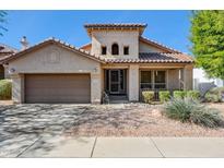 Charming single-story home with desert landscaping, tile roof, and attached two-car garage, perfect for comfortable living at 31016 N 42Nd Way, Cave Creek, AZ 85331