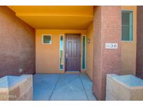 Front entrance of a contemporary townhome with a private patio at 6745 N 93Rd Ave # 1138, Glendale, AZ 85305