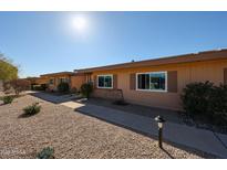 Cozy home exterior with desert landscaping and bright sunny skies at 13861 N 111Th Ave, Sun City, AZ 85351