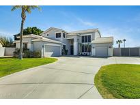 Stunning two-story home with lush lawn and a three car garage at 2105 N Kachina --, Mesa, AZ 85203