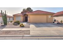 One-story house with desert landscaping and a two-car garage at 2409 E Antigua Dr, Casa Grande, AZ 85194