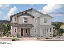 Two-story home with gray siding, red door, and stone accents at 2838 N Evergreen St, Buckeye, AZ 85396