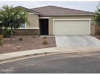 One-story house with attached garage and desert landscaping at 3014 N Majestic Ct, Casa Grande, AZ 85122