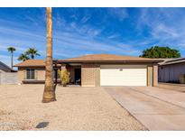 Charming single-story home with desert landscaping, a two-car garage and a well-maintained brick facade at 5114 W Corrine Dr, Glendale, AZ 85304