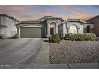 One story home with landscaped yard and two car garage at 937 N Kingston St, Gilbert, AZ 85233