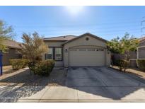 One-story house with a two-car garage and well-maintained landscaping at 9519 W Trumbull Rd, Tolleson, AZ 85353