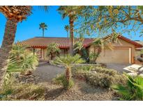 Charming single-story home with beautiful desert landscaping and a classic tile roof at 10899 E Kalil Dr, Scottsdale, AZ 85259