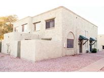 Tan two-story building with multiple units and small yards at 1500 W Rio Salado Pkwy # 74, Mesa, AZ 85201