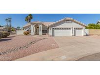 Charming single-story home featuring a three-car garage and well-maintained desert landscaping at 1582 W Chicago St, Chandler, AZ 85224