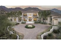 Stunning two-story home with a circular driveway and mountain views at 21487 N 110Th Pl, Scottsdale, AZ 85255