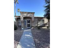 Single-story home with a landscaped front yard and neutral exterior at 19851 N Greenview N Dr, Sun City West, AZ 85375