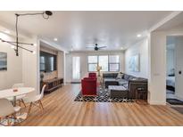 Open living room with modern furniture and hardwood floors at 34457 N Legend Trail Pkwy # 1018, Scottsdale, AZ 85262