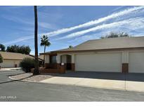 Charming single-story home featuring a two-car garage and desert landscaping at 8260 E Keats Ave # 500, Mesa, AZ 85209