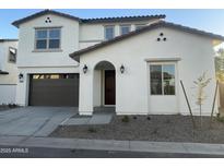 Two-story home with attached garage and landscaping at 9221 E Sector Dr, Mesa, AZ 85212