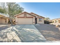 One-story house with a two-car garage and desert landscaping at 9477 W Frank Ave, Peoria, AZ 85382