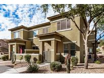 Charming townhome with desert landscaping, front gated entry, and a covered porch at 15240 N 142Nd Ave # 1149, Surprise, AZ 85379