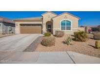 Charming single-story home featuring a two-car garage and desert landscaping for low maintenance at 24338 W Albeniz Pl, Buckeye, AZ 85326