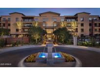 Luxury apartment building with fountain and landscaping at 6166 N Scottsdale Rd # C2008, Paradise Valley, AZ 85253