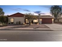 Single-story home with red-tiled roof and attached garage at 753 W Pampa Ave, Mesa, AZ 85210