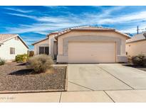 Charming single-story home featuring a two car garage and low maintenance front yard at 8553 N 112Th Ave, Peoria, AZ 85345