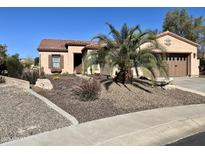 Single-story home with desert landscaping and two-car garage at 13050 W Pinnacle Vista Dr, Peoria, AZ 85383
