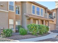 Charming townhouse exterior with desert landscaping and a private, two-story facade at 14250 W Wigwam Blvd # 2822, Litchfield Park, AZ 85340