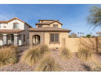Two-story house with stone accents and landscaped front yard at 17855 N 114Th Dr, Surprise, AZ 85378