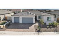 Single-story home with two-car garage and desert landscaping at 17899 W Mountain Sky Ave, Goodyear, AZ 85338