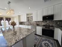 Modern kitchen with granite countertops and stainless steel appliances at 2073 E Wildhorse Dr, Chandler, AZ 85286