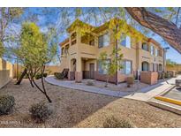 A two-story condo with a well-maintained lawn and mature trees offering an inviting curb appeal at 2134 E Broadway Rd # 2033, Tempe, AZ 85282