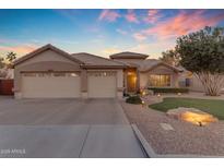 Beautiful single-story home with a three-car garage and landscaped front yard at 3523 W Shannon St, Chandler, AZ 85226