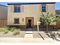 Charming two-story home featuring a welcoming front yard and neutral-toned exterior at 3937 S 79Th Ln, Phoenix, AZ 85043