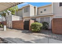 Attractive exterior of a townhome with a private entrance and landscaping at 625 S Westwood -- # 102, Mesa, AZ 85210