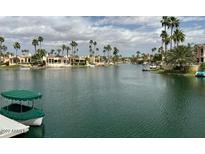 Stunning canal-front property with lush landscaping and boat access at 10120 E Topaz Dr, Scottsdale, AZ 85258